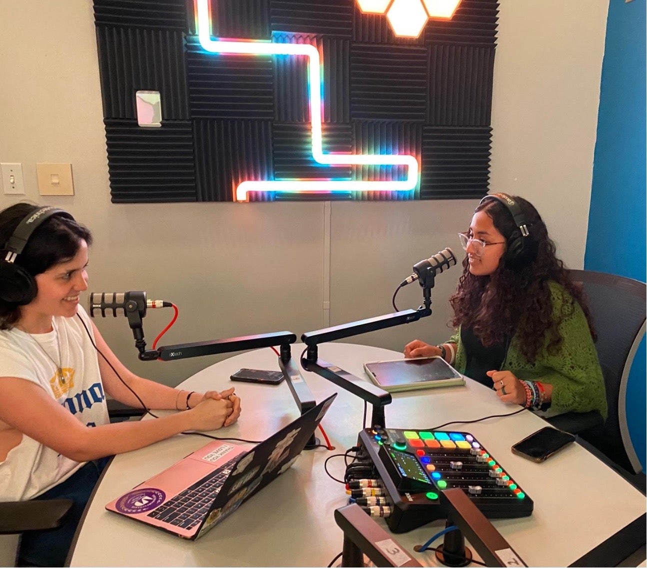 Two women recording a podcast